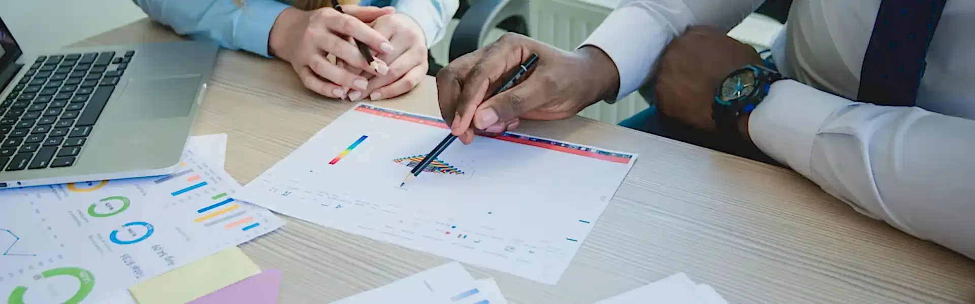 Team discussing business strategy before a client consultation call. Team discussing key business details before a client Business Consulting call to provide strategic guidance.